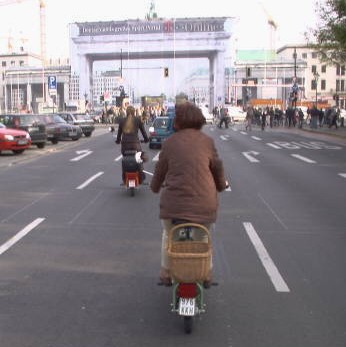 Electric vehicles drive through the city