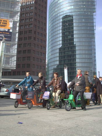 Electric vehicles drive through the city