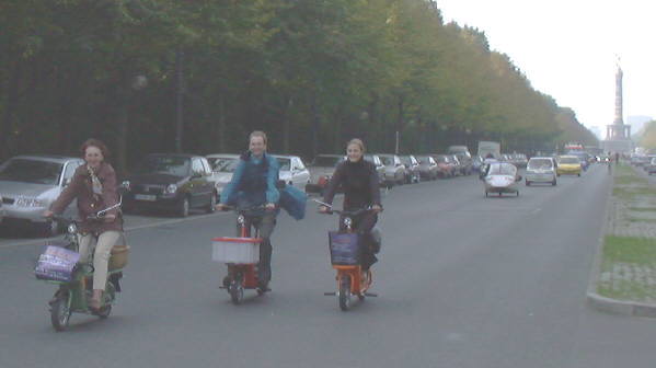 Electric vehicles drive through the city